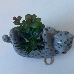 Ceramic cat with greenery plant